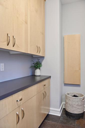Plenty of laundry storage and ironing board