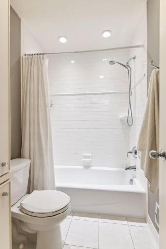 Nice doorway separates the shower from the sink area for privacy.