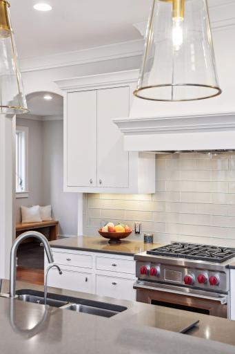 The kitchen flows to the laundry and mudroom (behind)
