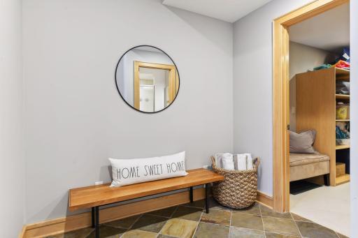 Pool guest can walk-in here from the outside patio to dry off and use the bathroom just a few steps ahead from here.. This entry connects to the Work-out flex room and rec room.