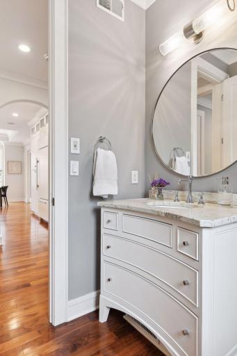 Main floor 1/2 bath within steps to the Office/Den, Laundry, Kitchen and Mudroom.