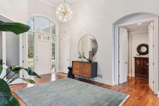 Spacious welcoming front foyer that features a newly installed on trend Kate Spade brand chandelier...