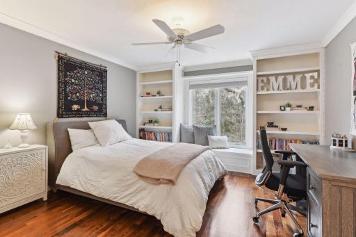 Upper Bedroom #1 with charming built-ins and nook. Bedrooms and loft area have zone heating feature.