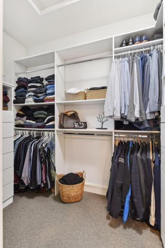 Primary suite walk in closet (photo only showing the one side of two)