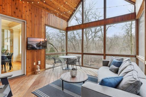 Well designed placement of the screened in porch as it lends a nice overlooking view to the pool and woods behind.