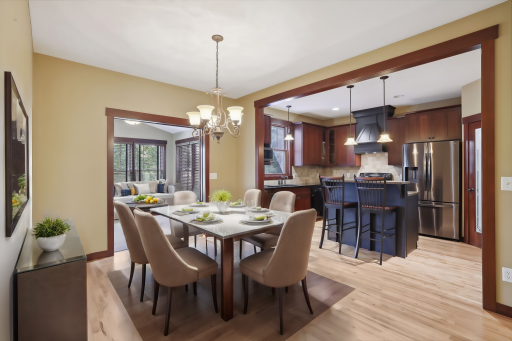 Gourmet kitchen with two-tone cabinets, glass door pantry, center island, informal dining and more! *Virtually staged to show design options.