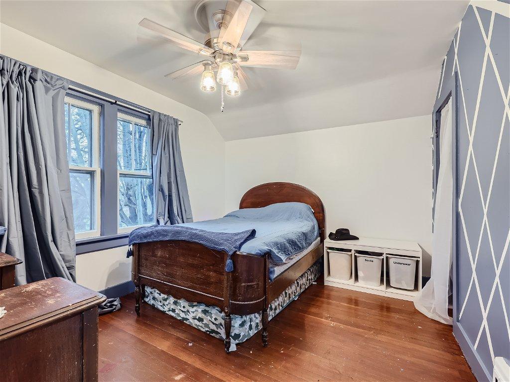 Bedroom #4 found upstairs - wood floors & walk-in closet