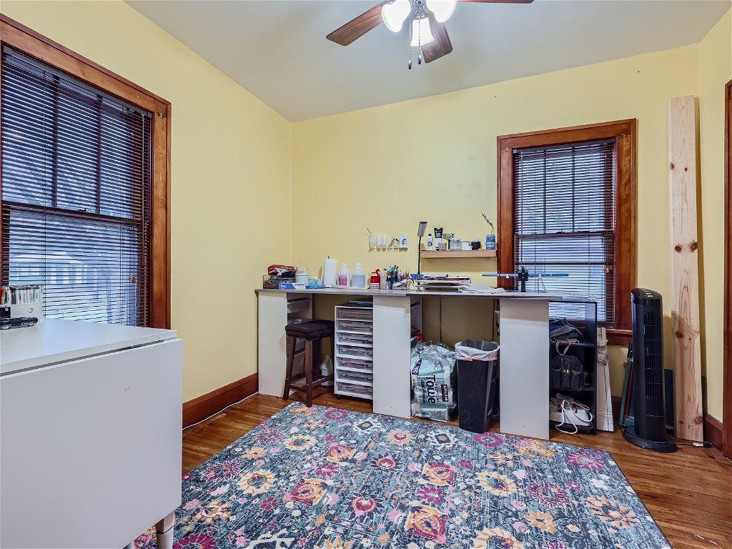 One of the 2 main floor bedrooms. - You'll love the original wood floors & doors!