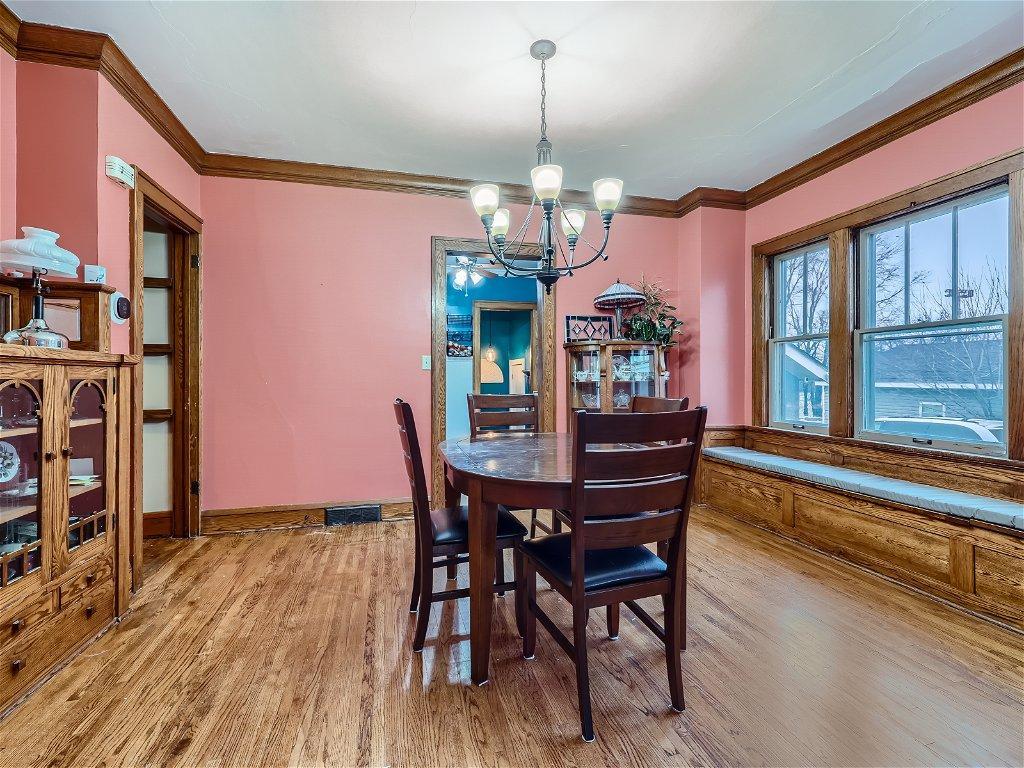 Wonderful dining room w/ built-in hutch & charming window seat w/ storage.