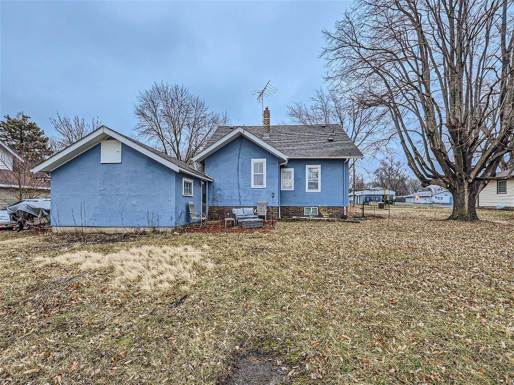 Back of the home. Prime location - just across the street from park w/ pool & just a short walk to watch the ball games