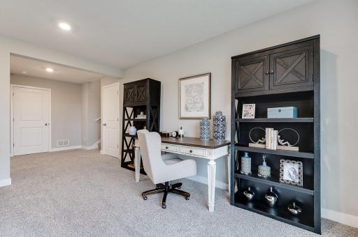 The completed lower level offers a large rec room, bathroom, and bedroom. *Photo of previous model home. Colors and selections may vary from what is shown.
