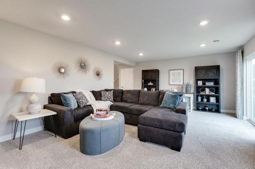 The completed lower level offers a large rec room, bathroom, and bedroom. *Photo of previous model home. Colors and selections may vary from what is shown.