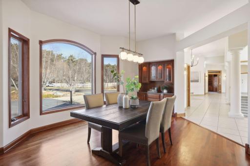 Beautiful windows adorn the formal dining space