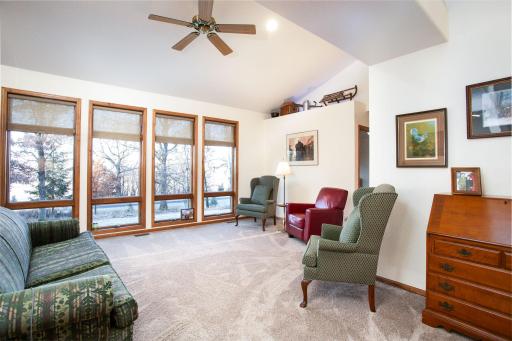 Living room with large windows and sun lit spaces