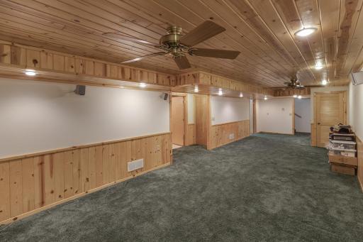 Photo for 5100 Camden Road, Baxter, MN 56425 - Listing #6487386 Lower level family room finished with a touch of knotty pine. Plenty of room for that big screen TV or turn it into a game room. Recessed lighting makes for a well lit room.