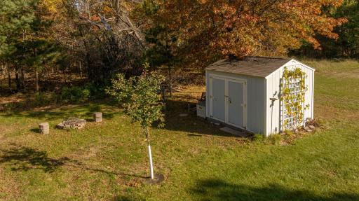 Photo for 5100 Camden Road, Baxter, MN 56425 - Listing #6487386 Storage shed in the back of the yard. The irrigation well is located near the shed. There is a fire pit for those nights you want to enjoy a campfire. Very private wooded area behind the home.