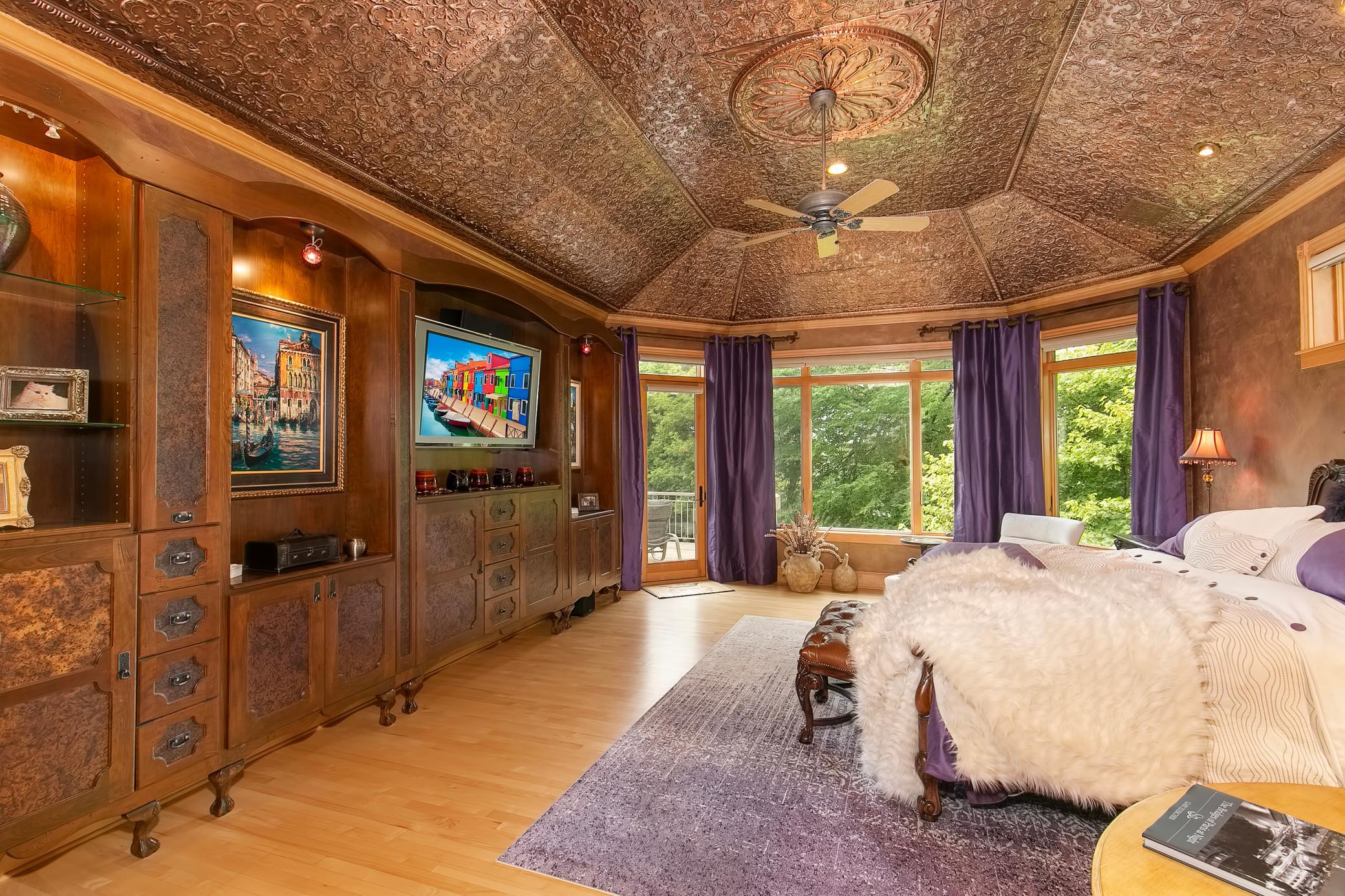 Lavish primary bedroom suite with huge walk in closet and walks out to your stunning outdoor deck overlooking your backyard oasis.