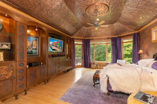 Lavish primary bedroom suite with huge walk in closet and walks out to your stunning outdoor deck overlooking your backyard oasis.