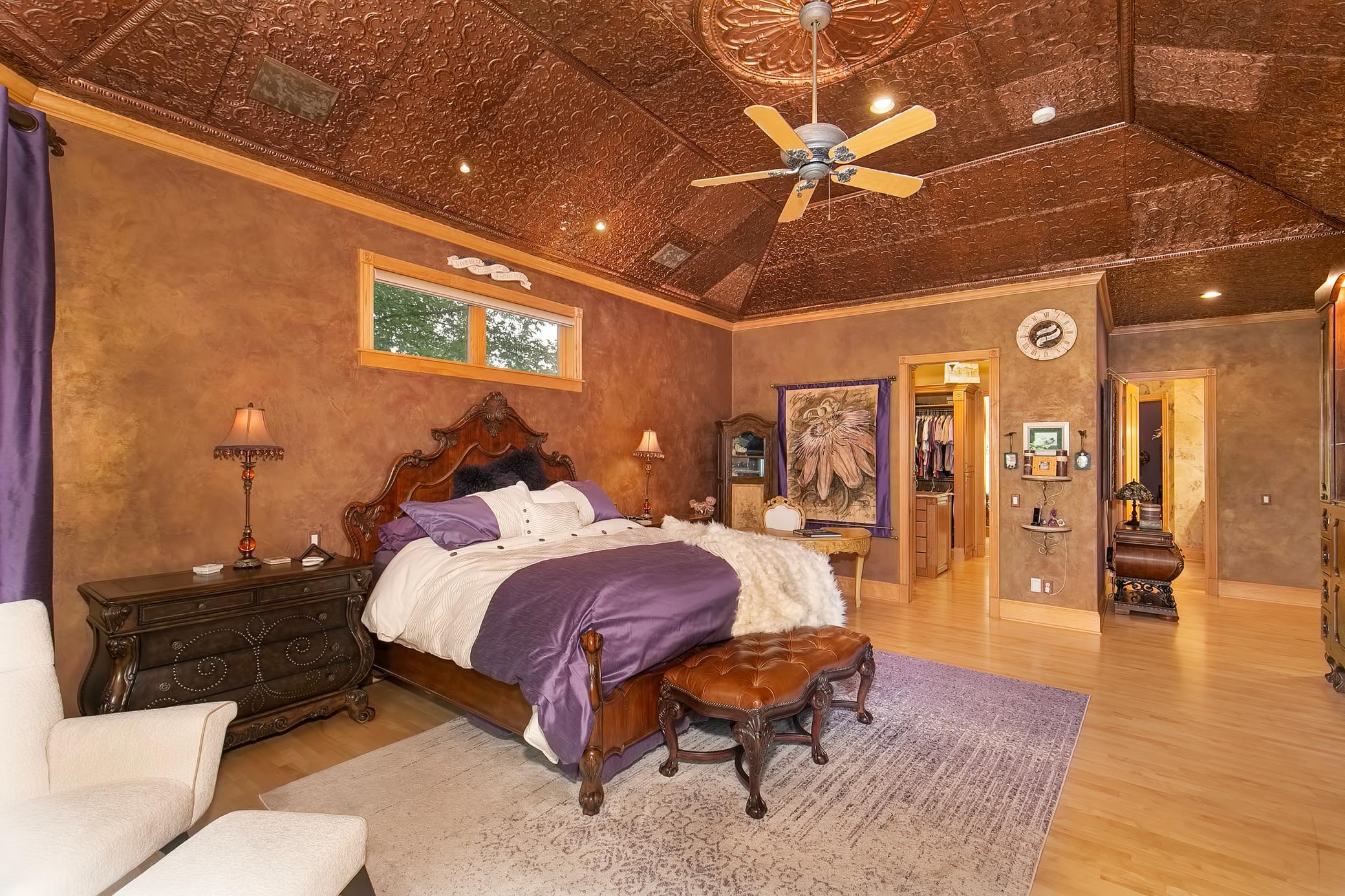 Lavish primary bedroom suite with huge walk in closet and walks out to your stunning outdoor deck overlooking your backyard oasis.