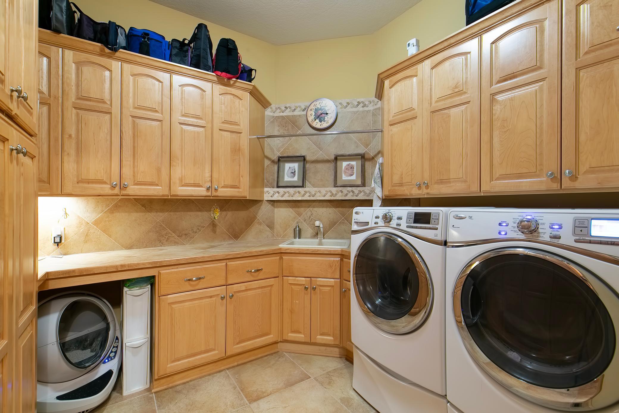 Main floor laundry with tons of storage space