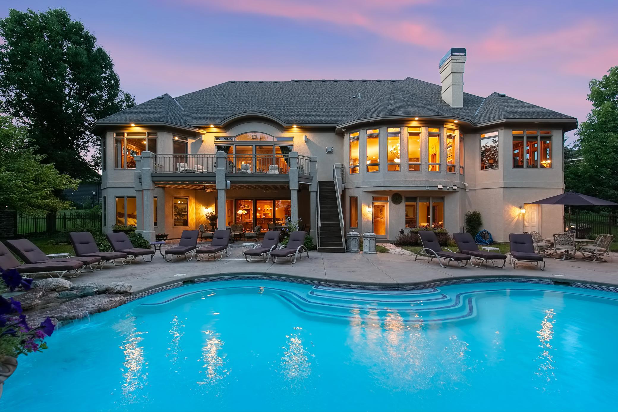 Luxurious custom-built Wooddale home perfectly nestled on a gorgeous, serene lot w/a backyard space you must see to believe!