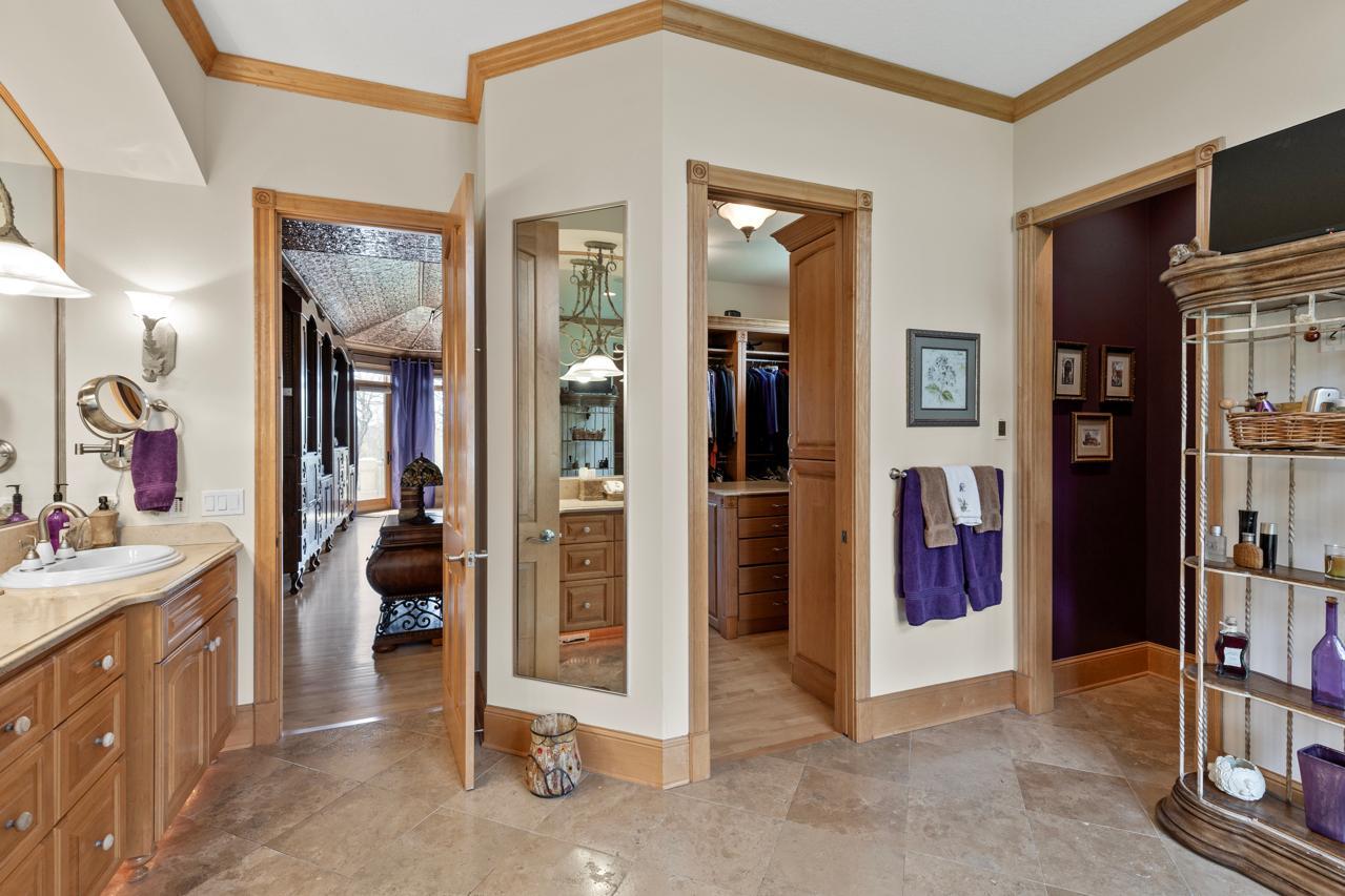 Private primary bathroom with relaxing tub and separate shower