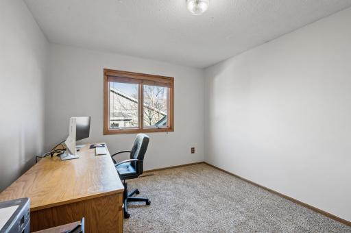 The second bedroom on the upper level is currently being used as an office. With new carpet and fresh paint you can easily move right in.