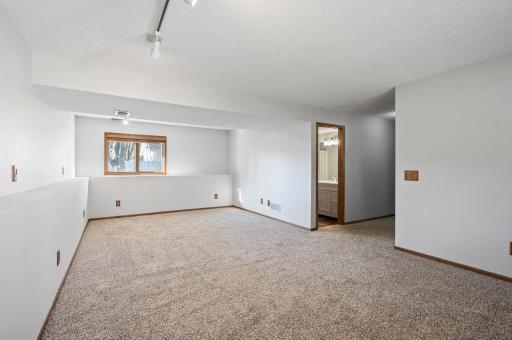 In this view of the lower level you can see how open the space is. With new carpet and fresh paint you can move your furniture right in and enjoy your new home.