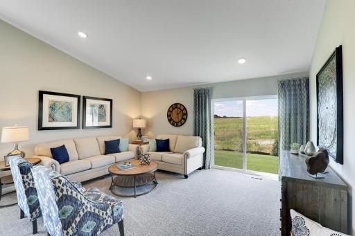 The family room is one of two similar living spaces in the home - each set up to meet all of your needs! Photo of model home, finishes will vary.