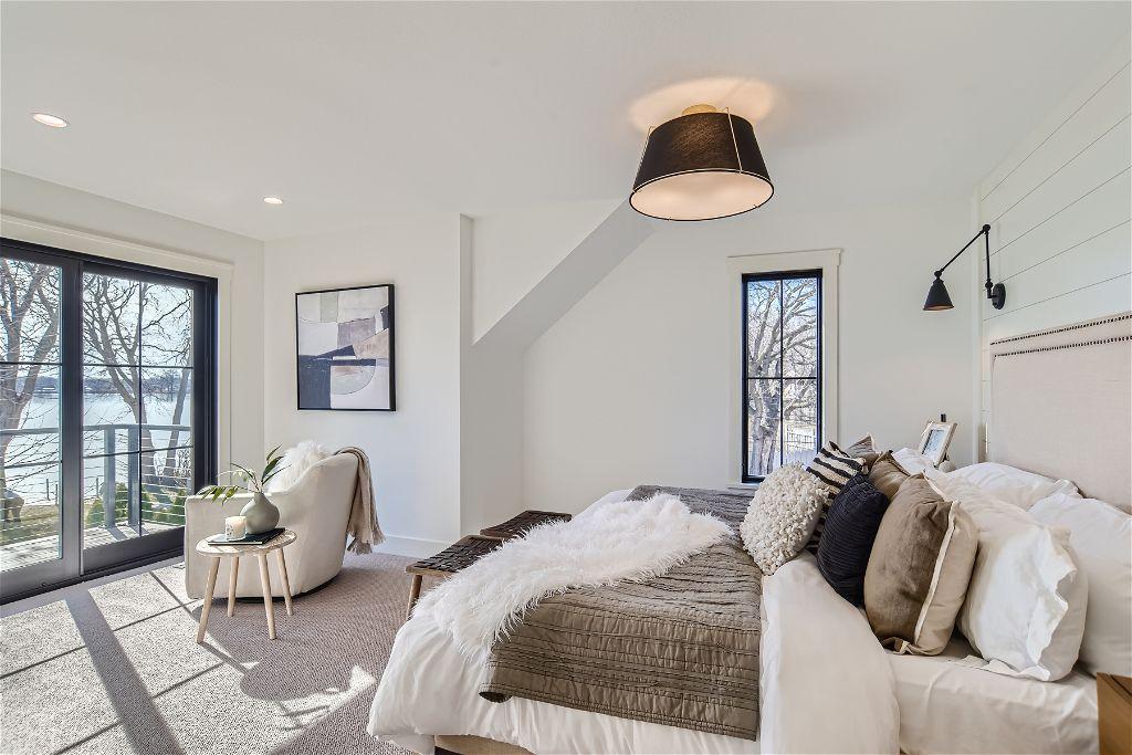 Upper level primary with walk-out deck to lake!