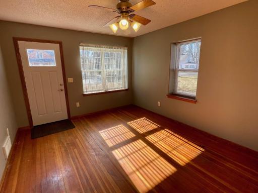 Front entry and living room area w/hardwood floors.