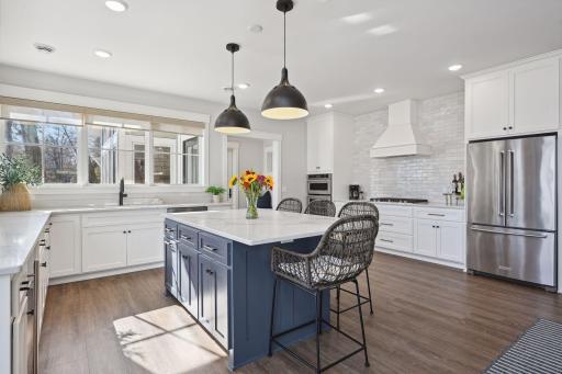 Double oven. Gas stove. Dishwasher. Large refrigerator/freezer. Additional beverage fridge.