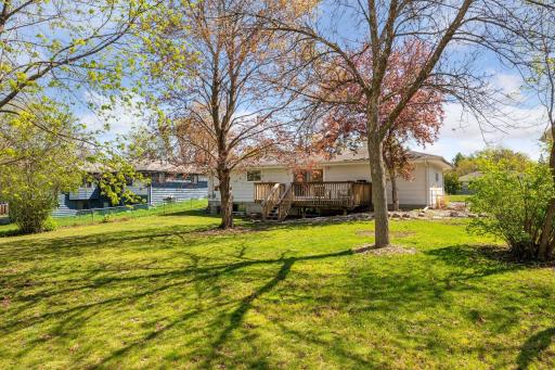 Fully fenced backyard with private deck and mature trees. Enjoy sunset on the back of the home and sunrise on the front.