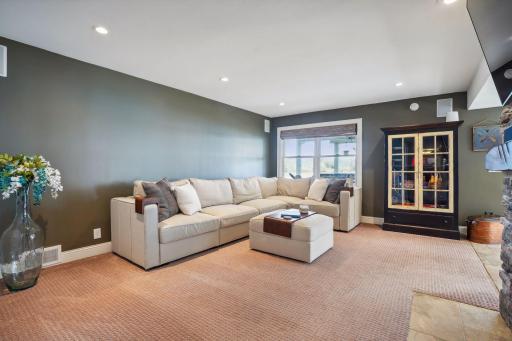 This lower-level family room offers another gathering space.