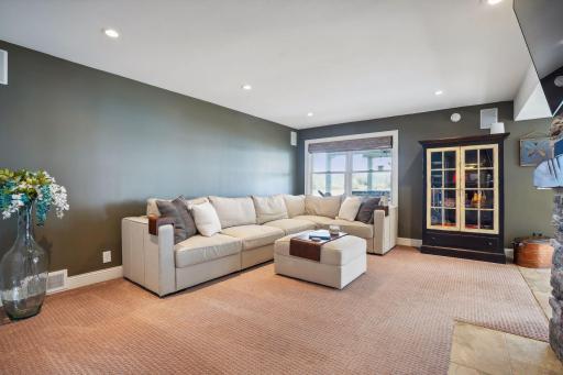 This lower-level family room offers another gathering space.