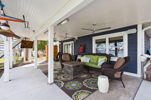 This patio has a water-resistant AZEK ceiling, 2 heaters, a fan and a TV!