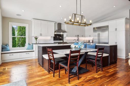 A new south-facing window (and cozy window seat) were added to keep this space light and bright.
A built-in banquette offers easy seating with family and friends.