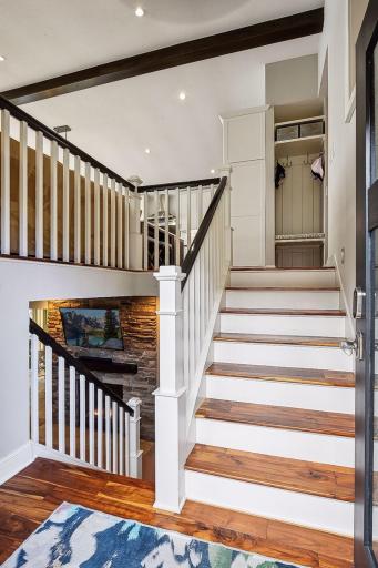 The warm acacia walnut hardwood floors extend from the stairway and throughout the upper floor.