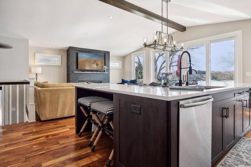 You won't miss a thing on TV. This great room was designed to include everyone, including the cook.
