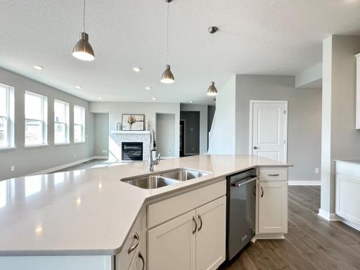 Home for sale will have white cabinets and quartz countertops shown above.
