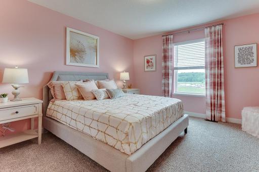The additional upper level bedrooms are spacious and have their own walk in closets! Example from model home.