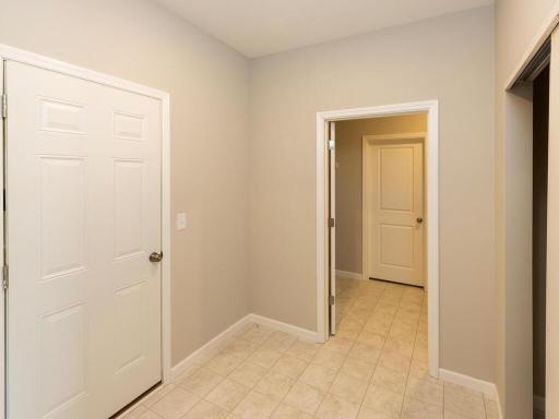 Mudroom. Photo taken of another home with similar plan and finishes. Photos and renderings may not depict actual plan, materials, & finishes may vary. All measurements are approximate.