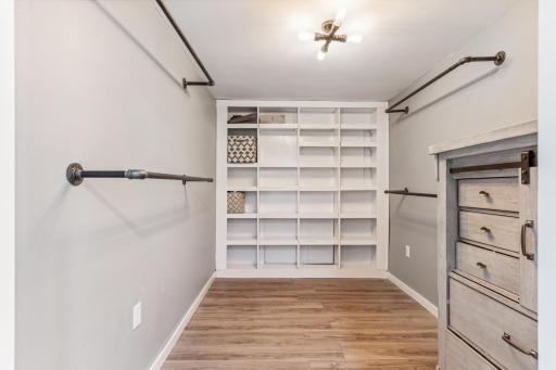 Lower level large 10'2 x 6'11 walk-in closet, perfect for organizing all of your clothes, hats, accessories.