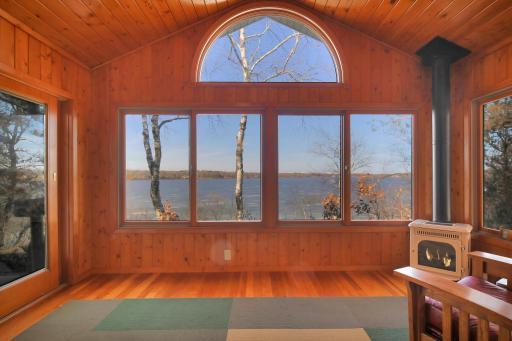 This sunroom also has great lake views & in-floor heat plus fireplace. Get cozy & snuggle in!