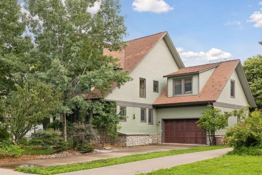 Tucked behind lush landscaping you will feel the privacy of a wooded setting in the city!