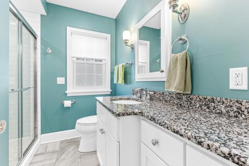 The main floor bathroom was completed remodeled in 2014. The bathroom features in-floor heat, a large custom vanity, a massive walk-in shower, new lighting, comfort height toilet, new window, etc. You name it, it was updated.