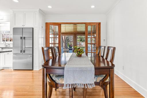 The dining area is ample and can comfortably seat 8-10 people. Throw open the doors to the 4 season porch to extend your dining area. The original french doors are exquisite.