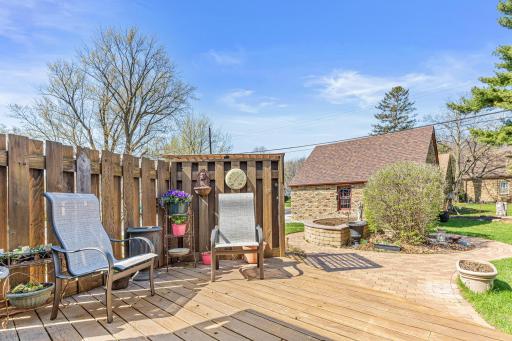 Enjoy basking in the sunshine from the privacy of this SW facing deck. The planter bed has already been planted and the graceful curves of the paver walkways add an organic feel to this beautiful yard.