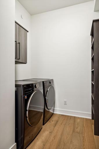 Laundry is conveniently tucked away in the primary walk-in closet space