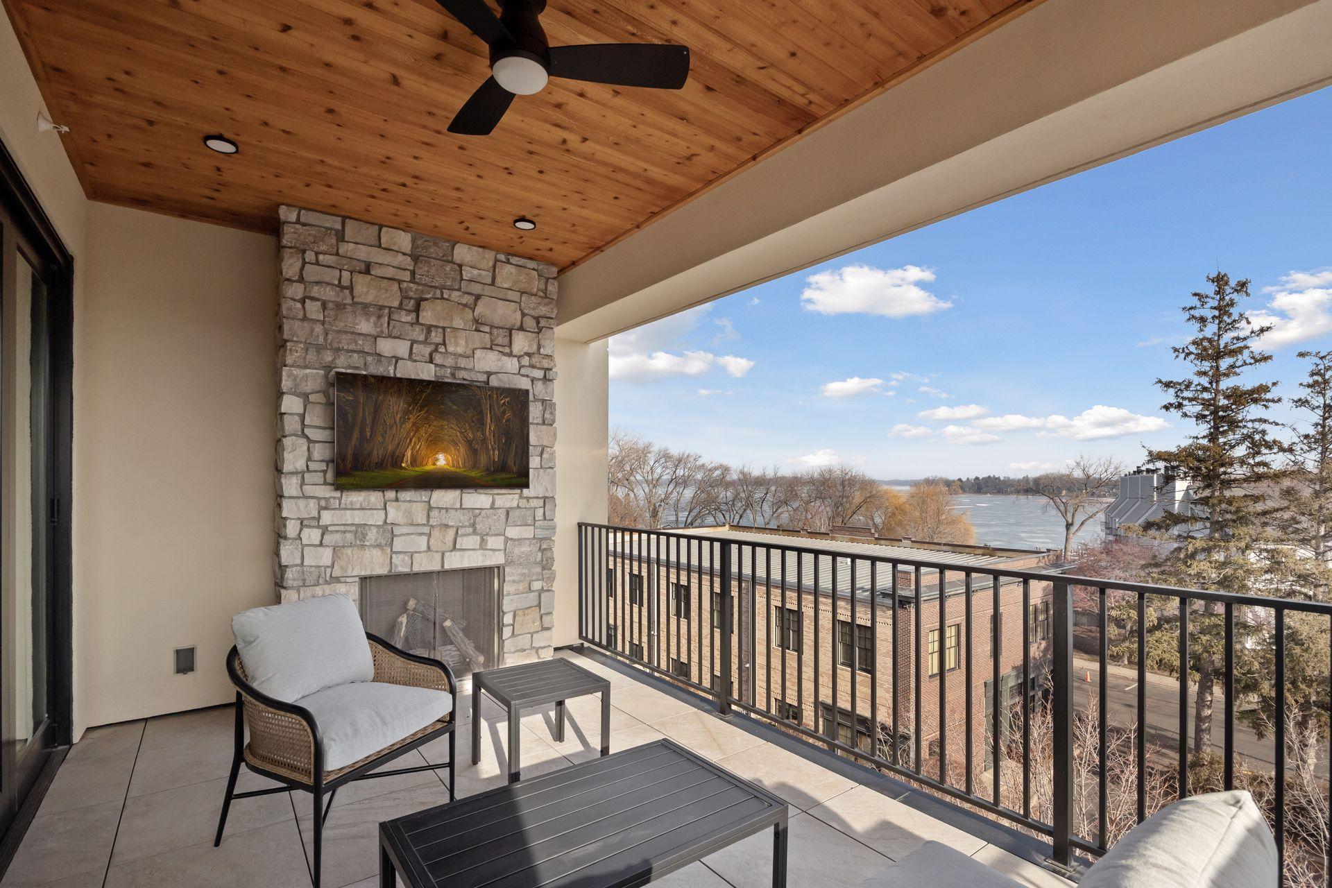Gas fireplace and cedar ceiling are features of the covered balcony space